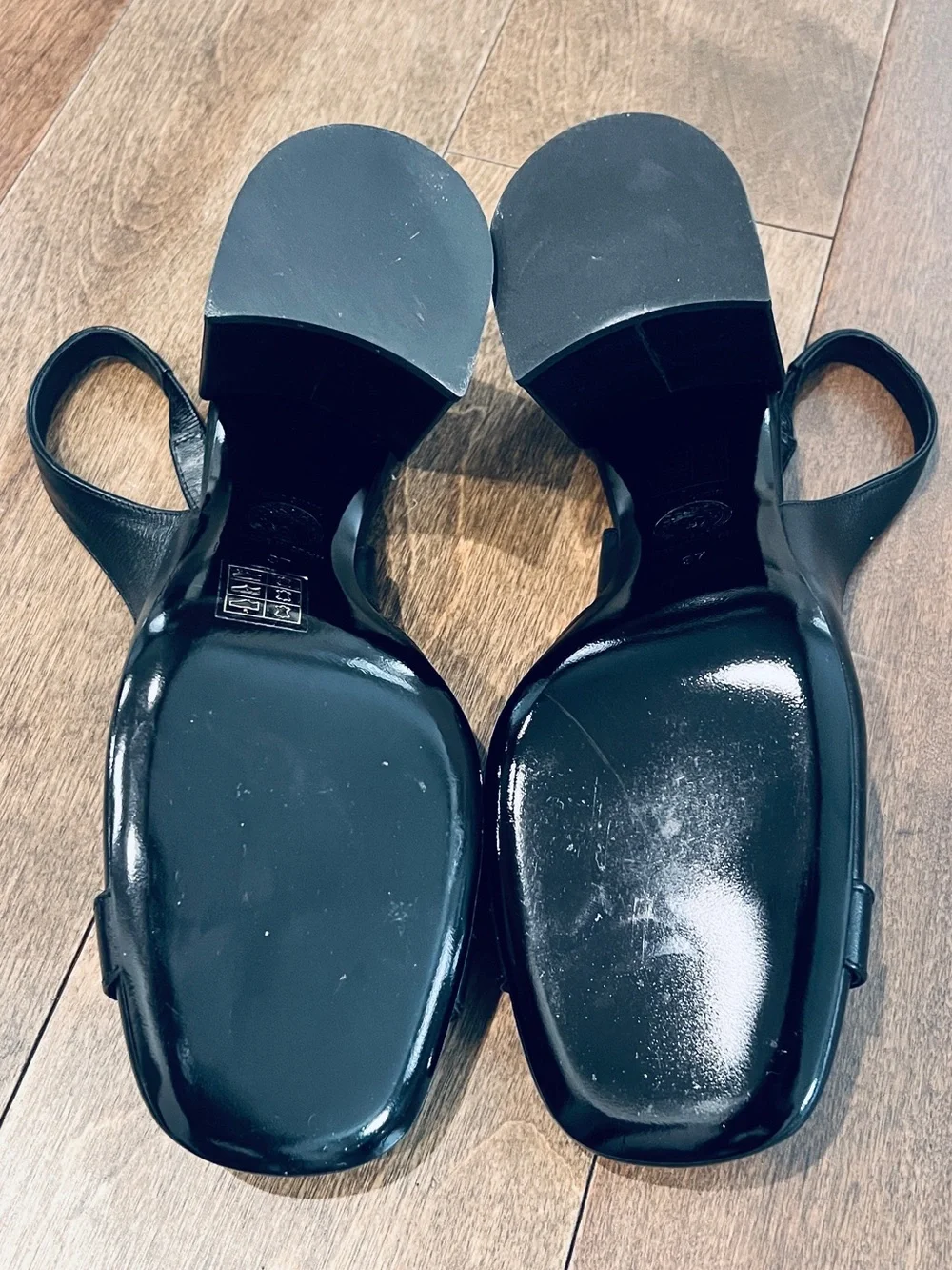 Classic Versace Black Leather Slingback Heels with Gold Medallion Accent
